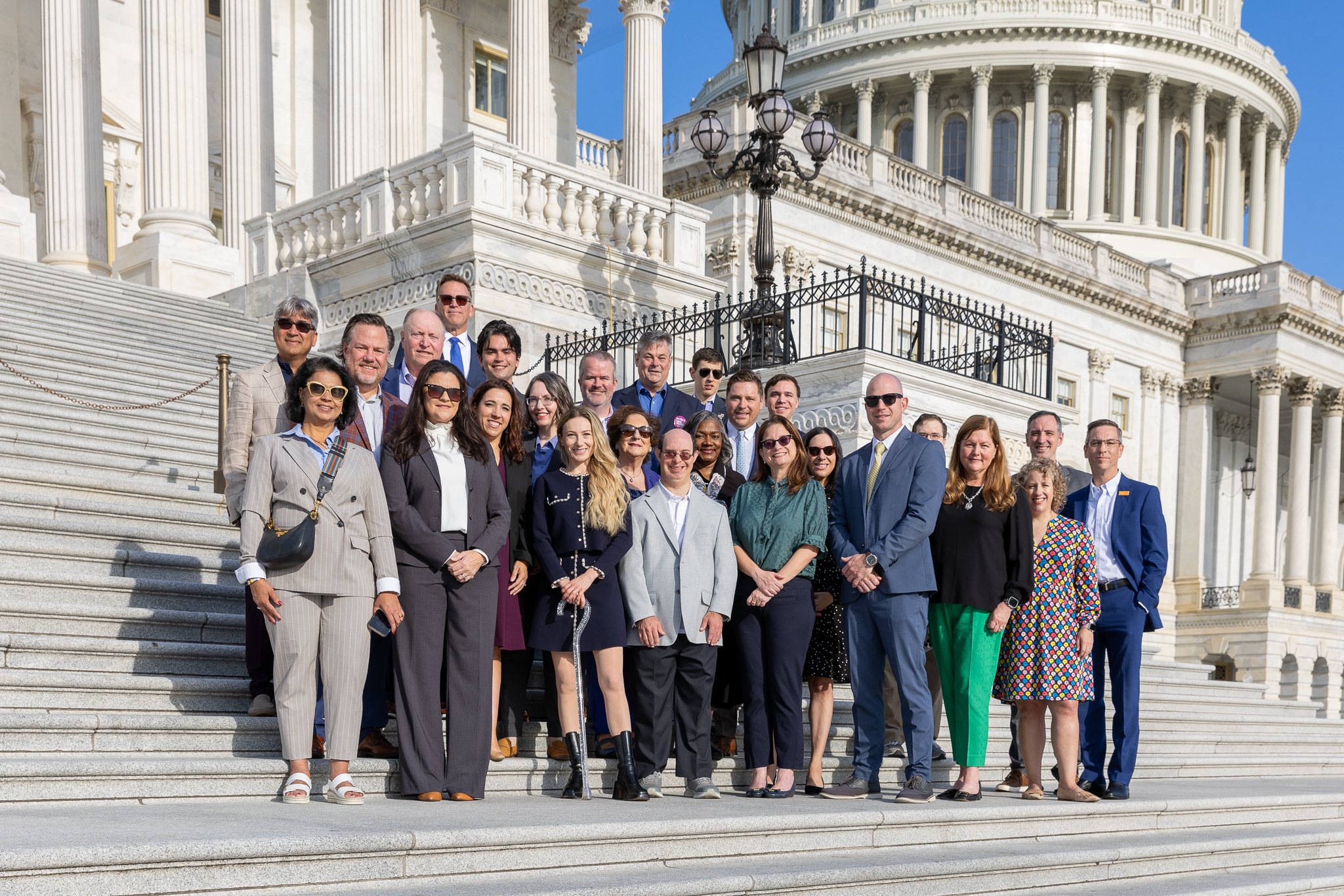 CEO Commission partners gathered on Capital Steps on a sunny day